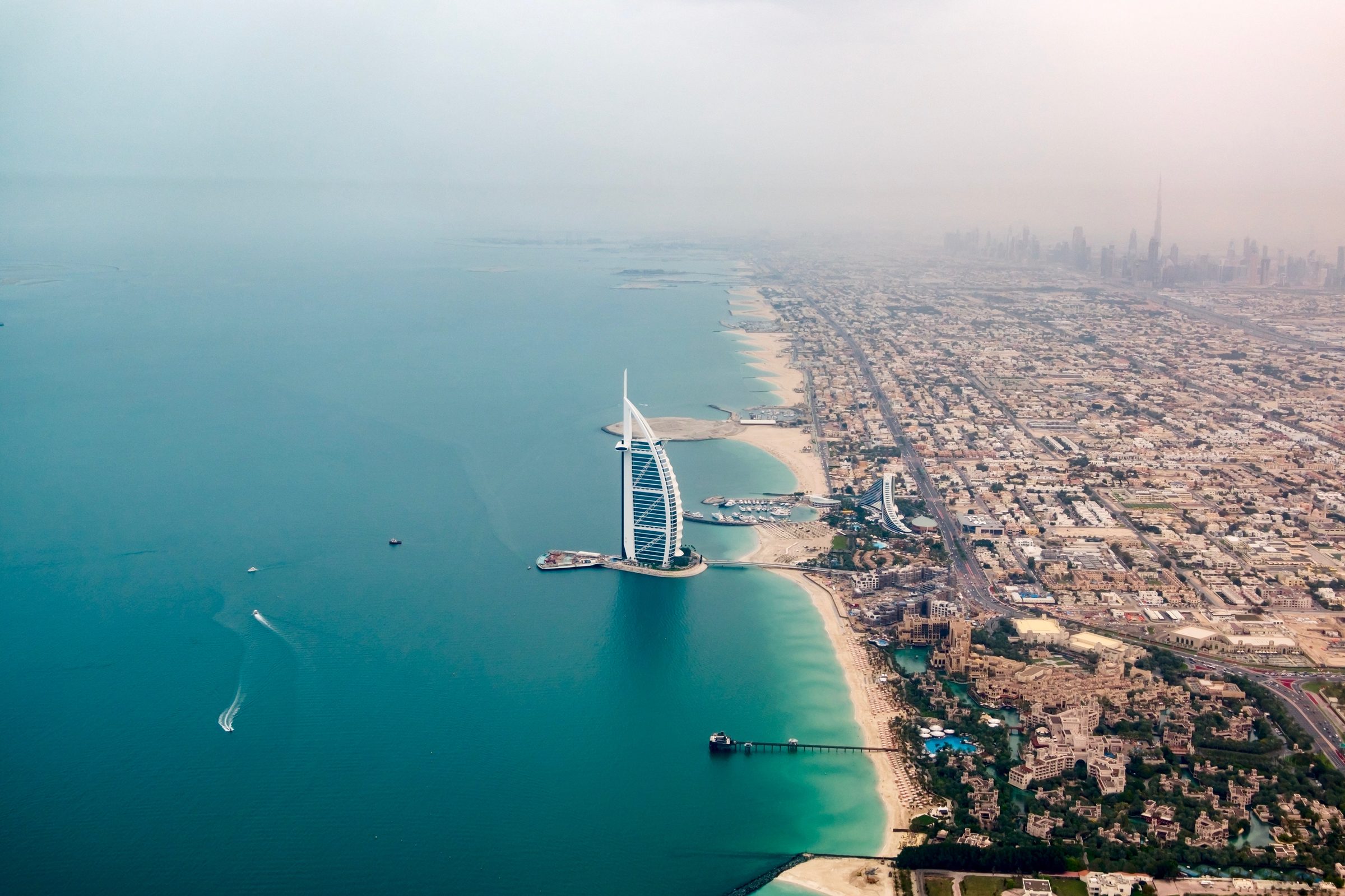 Aerial view of the Burj Al Arab, the Dubai coastline and the city